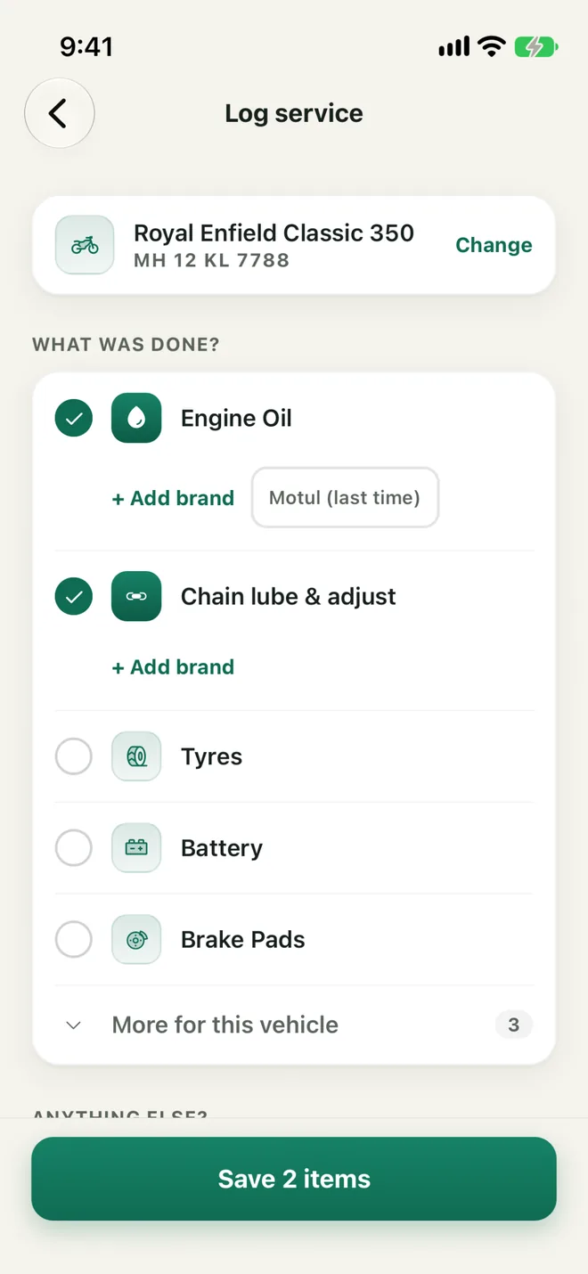 The Log service screen: Engine Oil and chain lube ticked, ready to save 2 items
